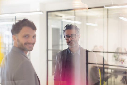 Portrait smiling, confident businessmen in office