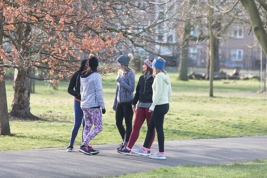 Female Runners Talking In Park