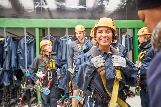 Portrait smiling, eager woman preparing to zip line