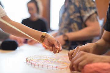 People doing string art project