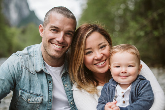 Portrait smiling parents and baby son