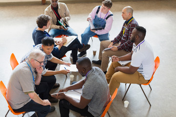 Men talking in group therapy