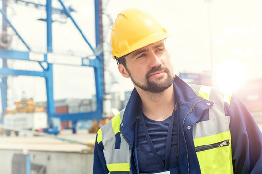 Confident dock worker at shipyard