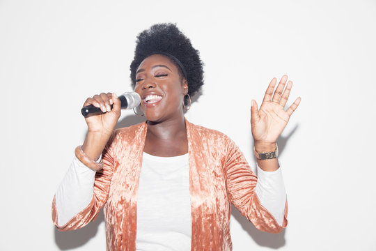 Woman singing with microphone