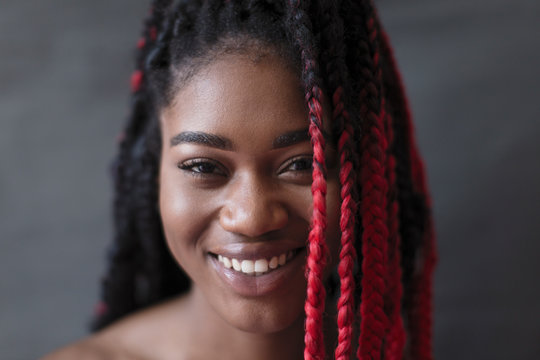 Portrait smiling, confident young woman with red braid