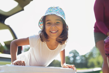 Portrait confident, happy girl in sun hat