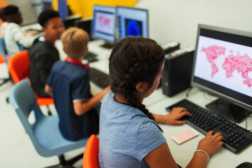 Junior high students using computers in computer lab
