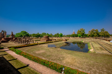 Background, the landmark of the Buddhist tourist attraction in Sukhothai Historical Park, tourists all over the world come to see the beauty always in Thailand.