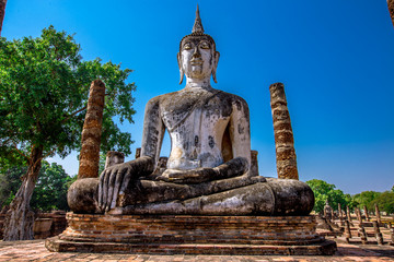 Background, the landmark of the Buddhist tourist attraction in Sukhothai Historical Park, tourists all over the world come to see the beauty always in Thailand.