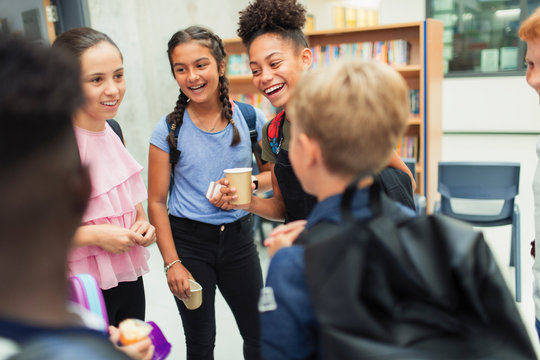 Junior high students talking, hanging out