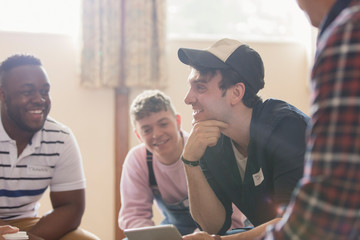 Men talking in group therapy