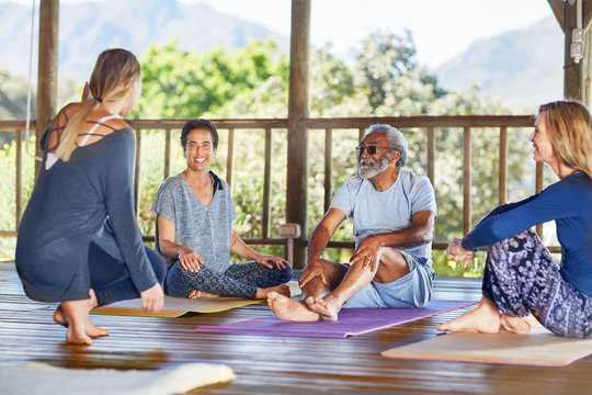 Yoga class talking in hut during yoga retreat
