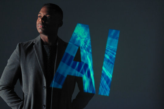 Double exposure serious businessman and AI text