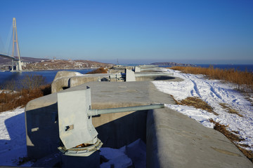 Landscape with a view of the Russian bridge against the blue sky.