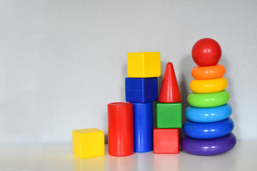 early development concept. educational toys for children cubes, blocks, pyramid. baby toys collection isolated on white background.
