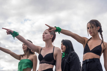 Group of feminist activists sing a 