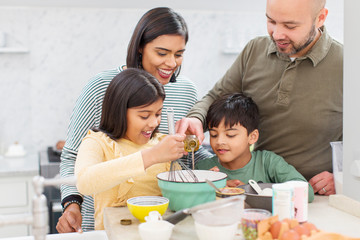 Family baking in kitchen