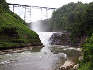 Old rail bridge on top of the water falls at Letchworth State Park, Upstate NY, USA