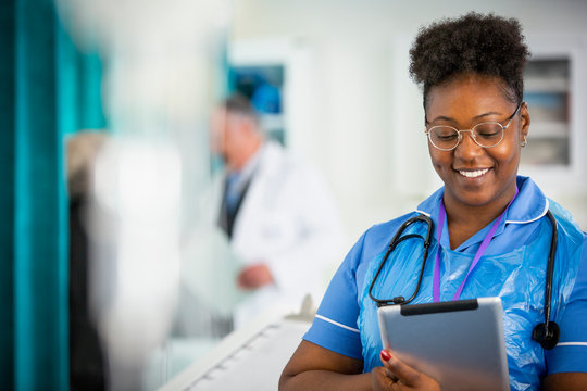 Female nurse using digital tablet in hospital