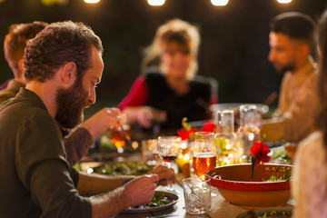 Friends enjoying dinner garden party