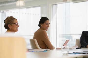 Happy businesswoman in conference room meeting