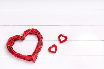 Valentines Day composition. Heart, gift on white wooden surface. Valentine's day concept. Flat lay, top view, from above