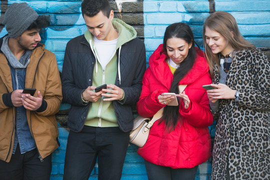 Young adults using smart phones