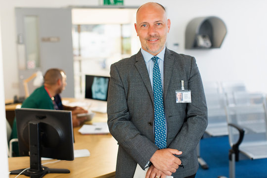 Portrait confident male administrator in clinic