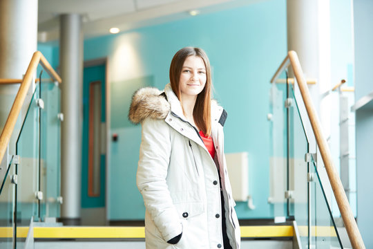 Portrait confident young female college student wearing coat