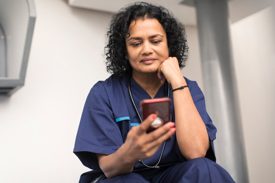 Female doctor using smart phone