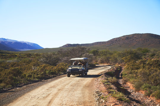 Safari off-road vehicle on sunny emote dirt road South Africa