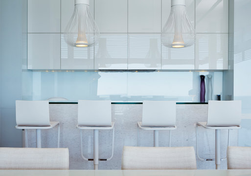 Modern white kitchen with breakfast bar and barstools