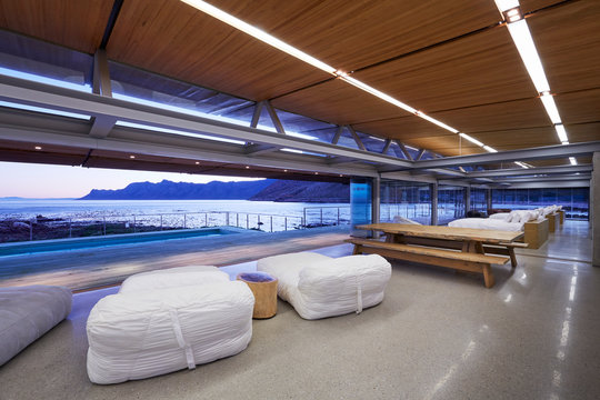 Modern hotel picnic table and beds overlooking ocean view