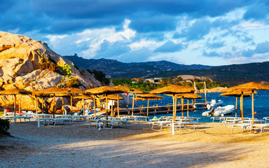Landscape with Romantic morning at Capriccioli Beach in of the Mediterranean sea on Sardinia island in Italy. Sky with clouds. Porto Cervo and Olbia province. Mixed media.