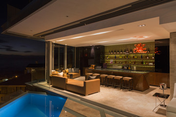 Luxury home showcase bar open to pool patio