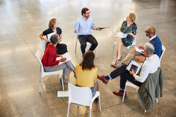 Business people talking in circle meeting