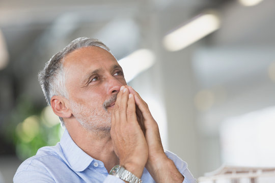 Pensive businessman looking away