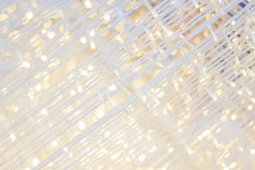 Beautiful White bright glistening string light celebrating New Year & Christmas tradition.Chick vintage cool background for social teenage magazine style. Vivid and lively sparkling little led light. 
