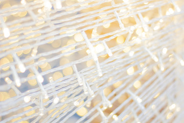 Beautiful White bright glistening string light celebrating New Year & Christmas tradition.Chick vintage cool background for social teenage magazine style. Vivid and lively sparkling little led light. 