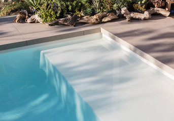 Sunny reflection over swimming pool