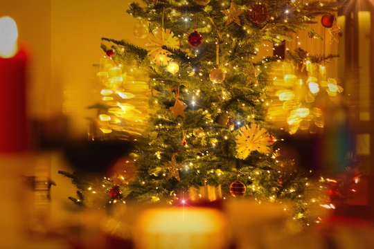 Illuminated Christmas tree with ornaments and string lights