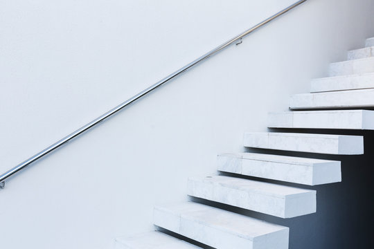 White, modern, minimalist floating staircase
