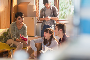 Young friend college student roommates moving into new apartment