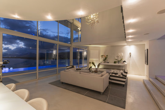Illuminated modern luxury home showcase interior at night