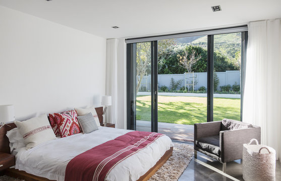 Home showcase interior bedroom with patio doors to garden