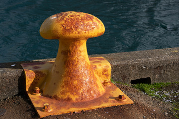 Metal bollard in harbour