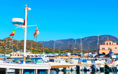 Old Sardinian Port and marina with ships at Mediterranean Sea in city of Villasimius in South...