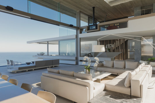 Modern, luxury home showcase interior living room with ocean view