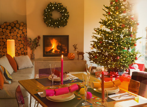 Ambient dining table, fireplace and Christmas tree in living room