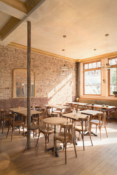 Wood tables and chairs in empty cafe